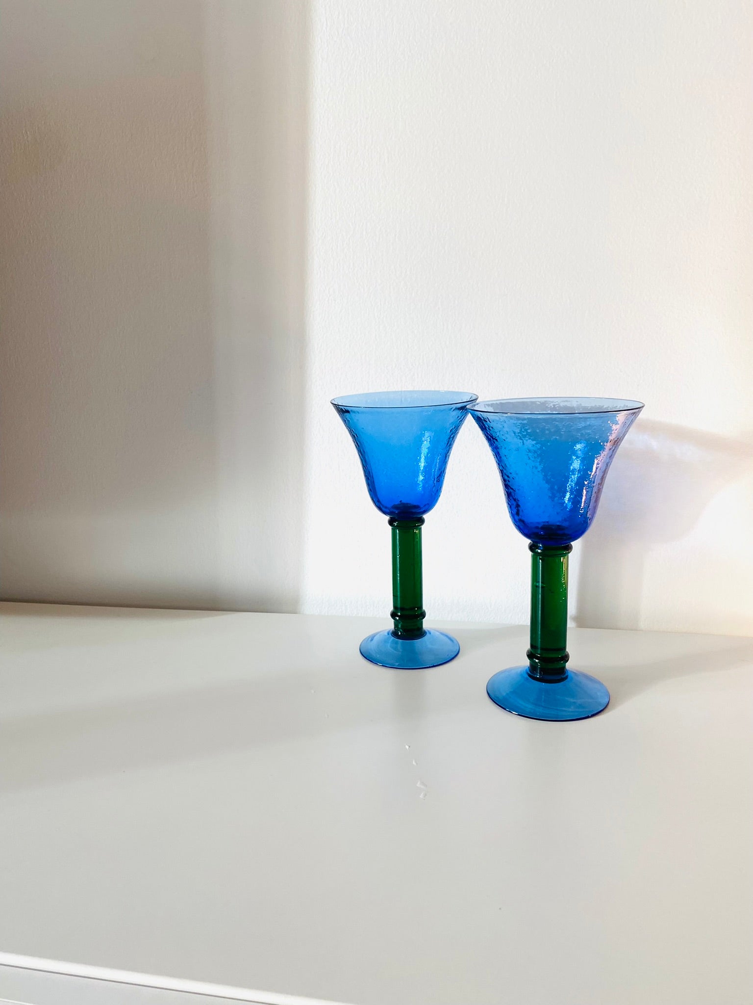 Set of 2 hand blown art glass drinking glasses blue with green stem