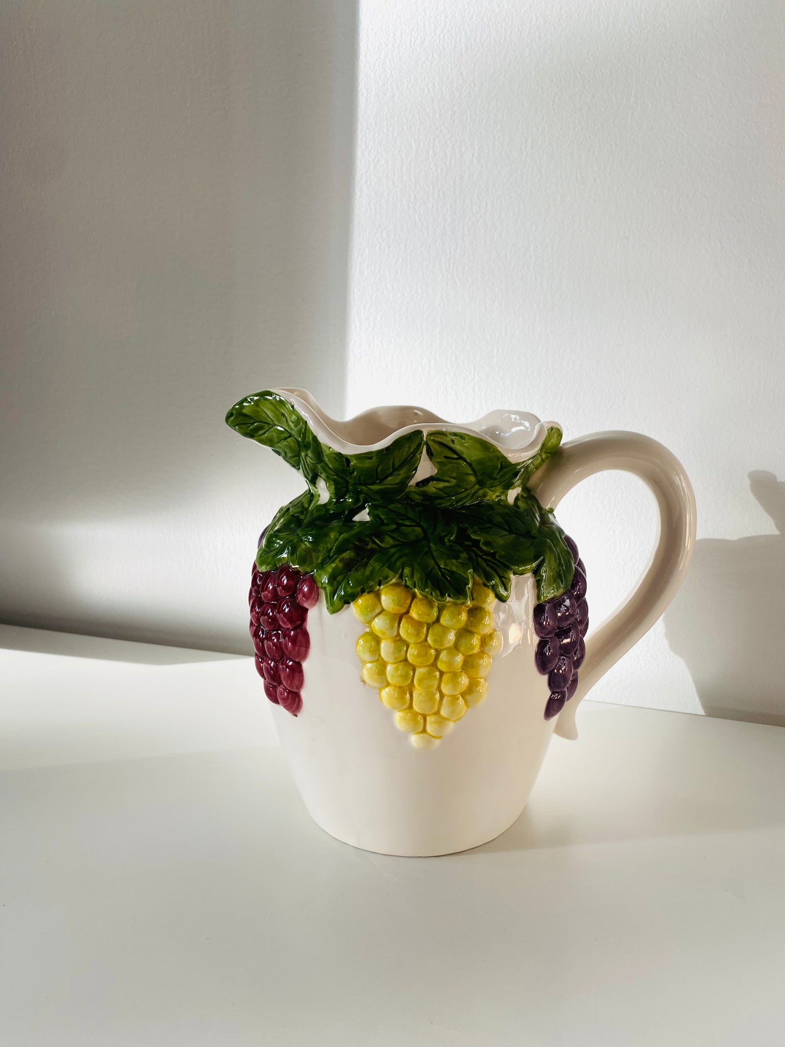 Ceramic pitcher w/fruit design