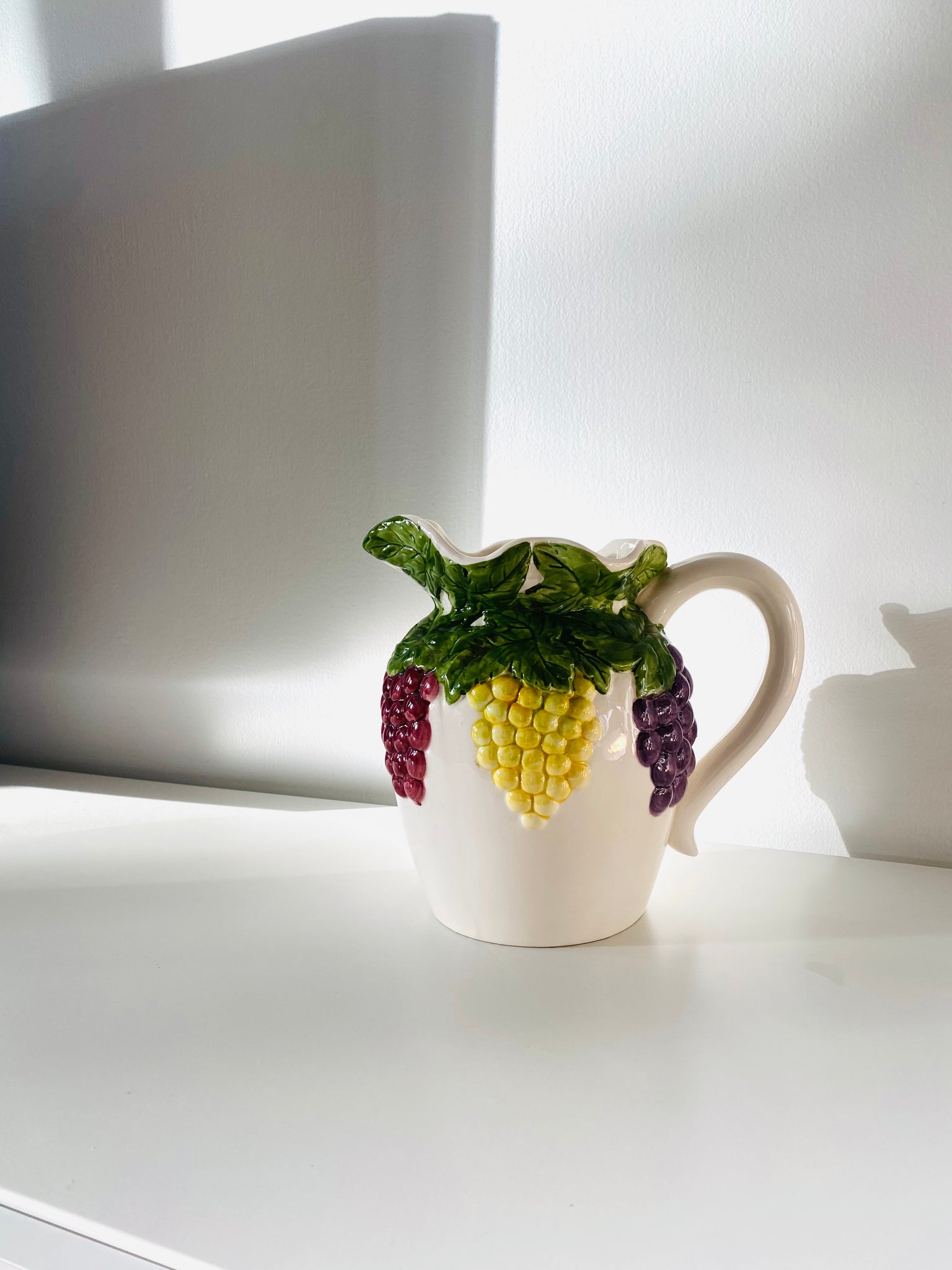 Ceramic pitcher w/fruit design